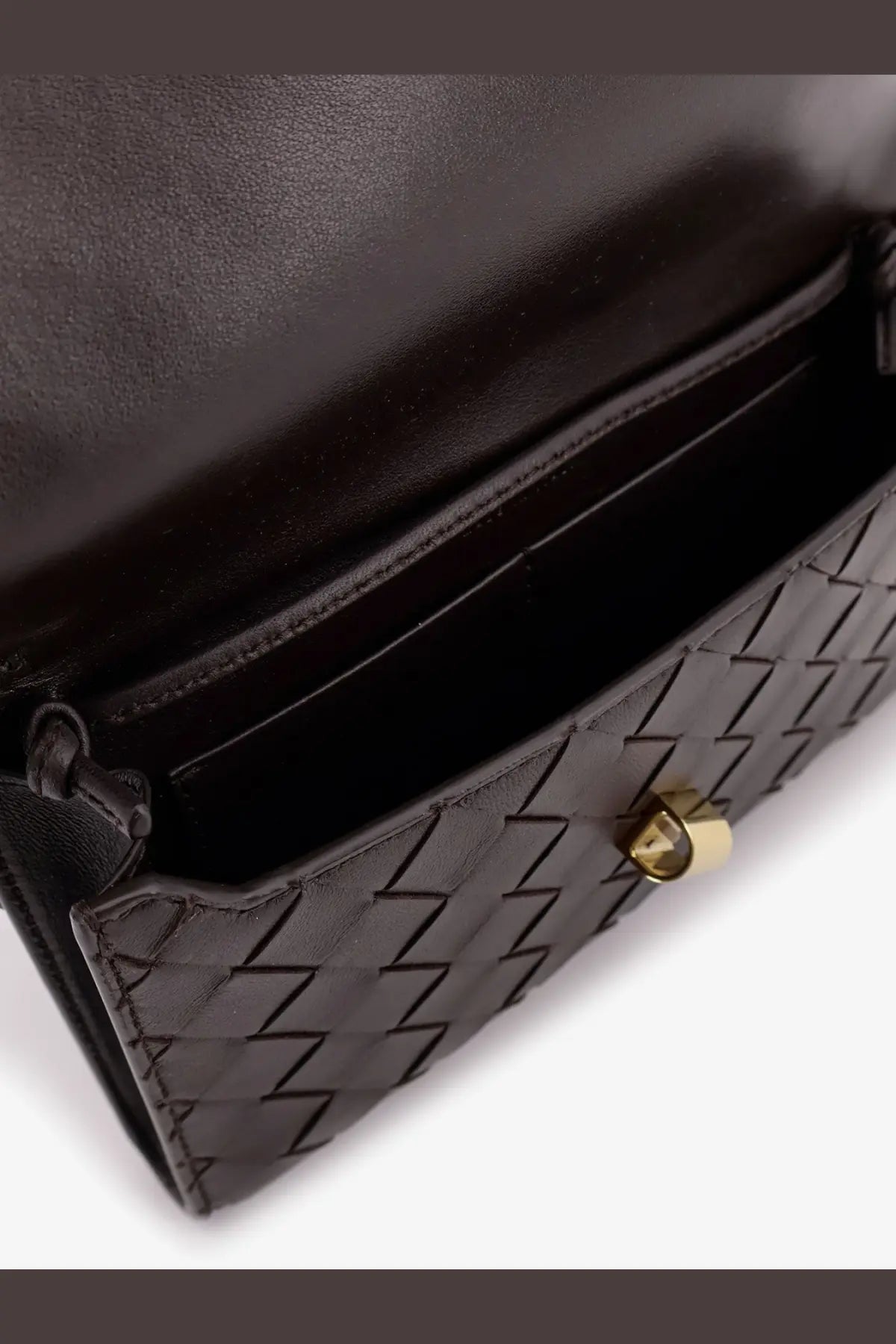 Bottega Veneta women’s Andiamo crossbody bag in brown woven leather with gold-tone hardware and black clutch detail