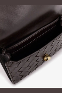 Bottega Veneta women’s Andiamo crossbody bag in brown woven leather with gold-tone hardware and black clutch detail