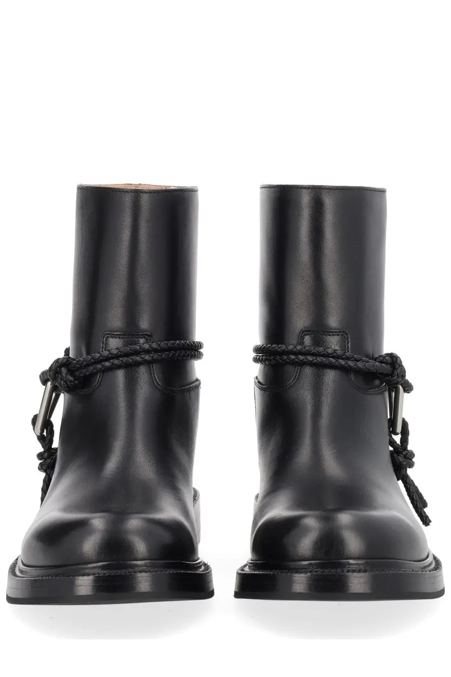 Bottega Veneta women’s black leather ankle boots with braided cord detailing and metal buckles visible from the back