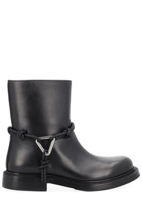 Bottega Veneta women’s black leather ankle boot with braided rope detail and silver triangular buckle front view