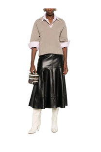 Black leather flared midi skirt showcasing smooth texture and structured design for stylish versatile wear