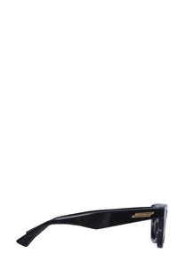 Bottega Veneta women’s classic sunglasses featuring a black glossy acetate frame with gold-tone metal detailing