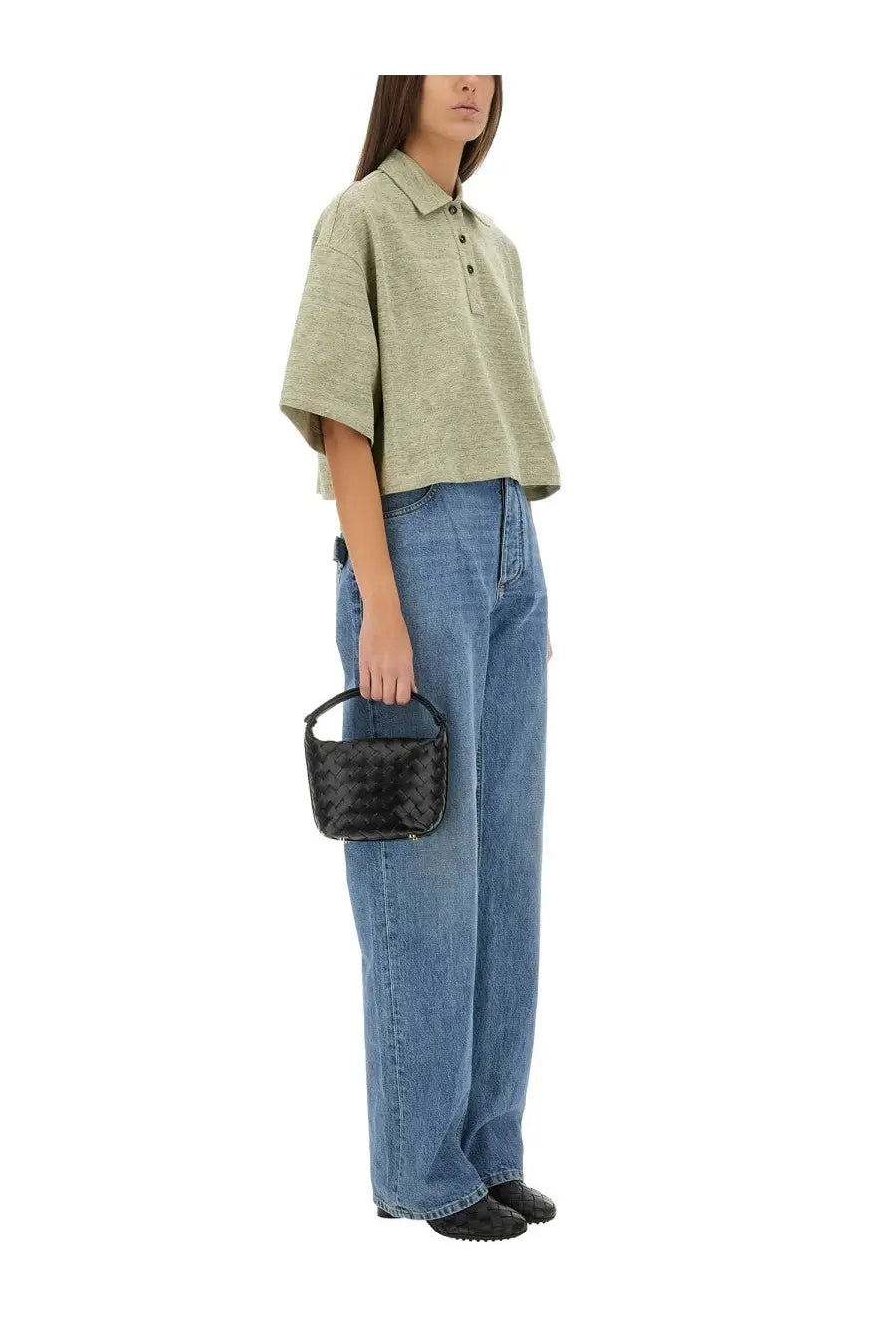 Black woven leather mini handbag with structured shape and top handle shown with bottega veneta beige cotton pique polo shirt