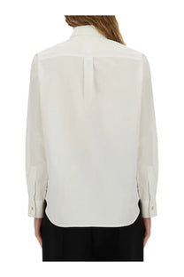 A crisp white silk blouse with classic collar and subtle back pleating from bottega veneta women’s cotton poplin shirt collection