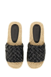 Bottega Veneta women’s black leather slide sandals with braided woven design and natural fiber soles