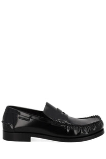 Bottega Veneta women’s moccasin loafer in black patent leather with glossy finish and decorative toe stitching