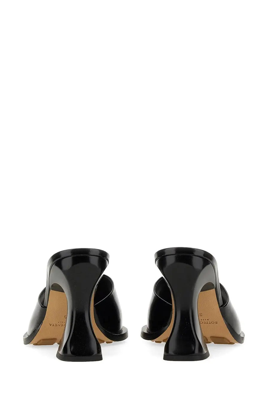 Bottega Veneta women’s black patent leather mules with sleek modern design and distinctive sculpted heel shown from back