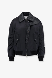 Bottega Veneta women’s black nylon bomber jacket with woven leather collar zipper trim two front pockets and ribbed cuffs
