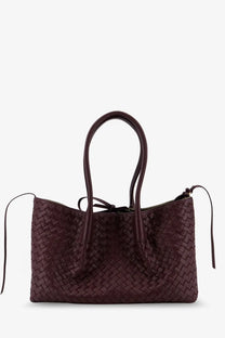 A deep burgundy woven leather tote bag with basketweave pattern and rounded handles by Bottega Veneta women’s pinacoteca