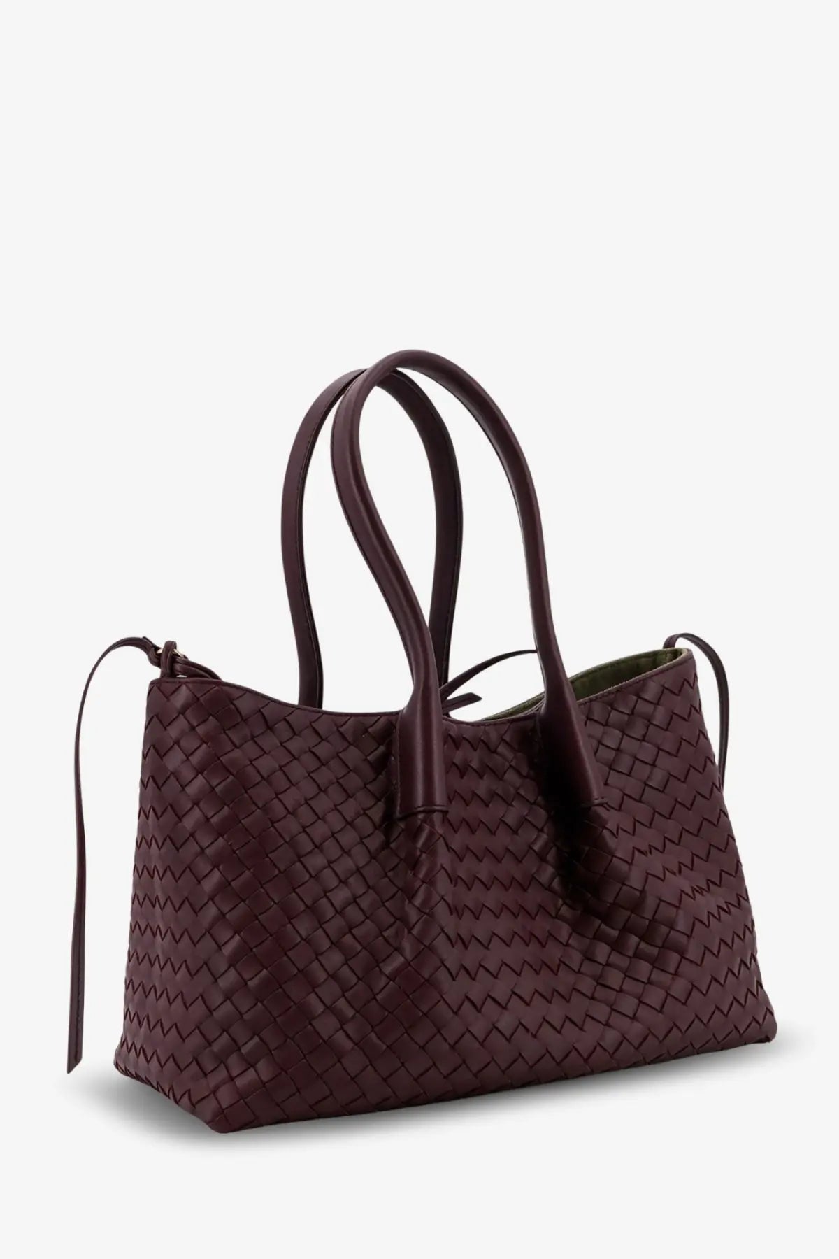 A deep burgundy woven leather tote bag with a zigzag pattern and structured handles by Bottega Veneta