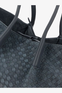 Dark gray woven leather tote bag with structured handles and sleek textured surface by bottega veneta cloudly collection