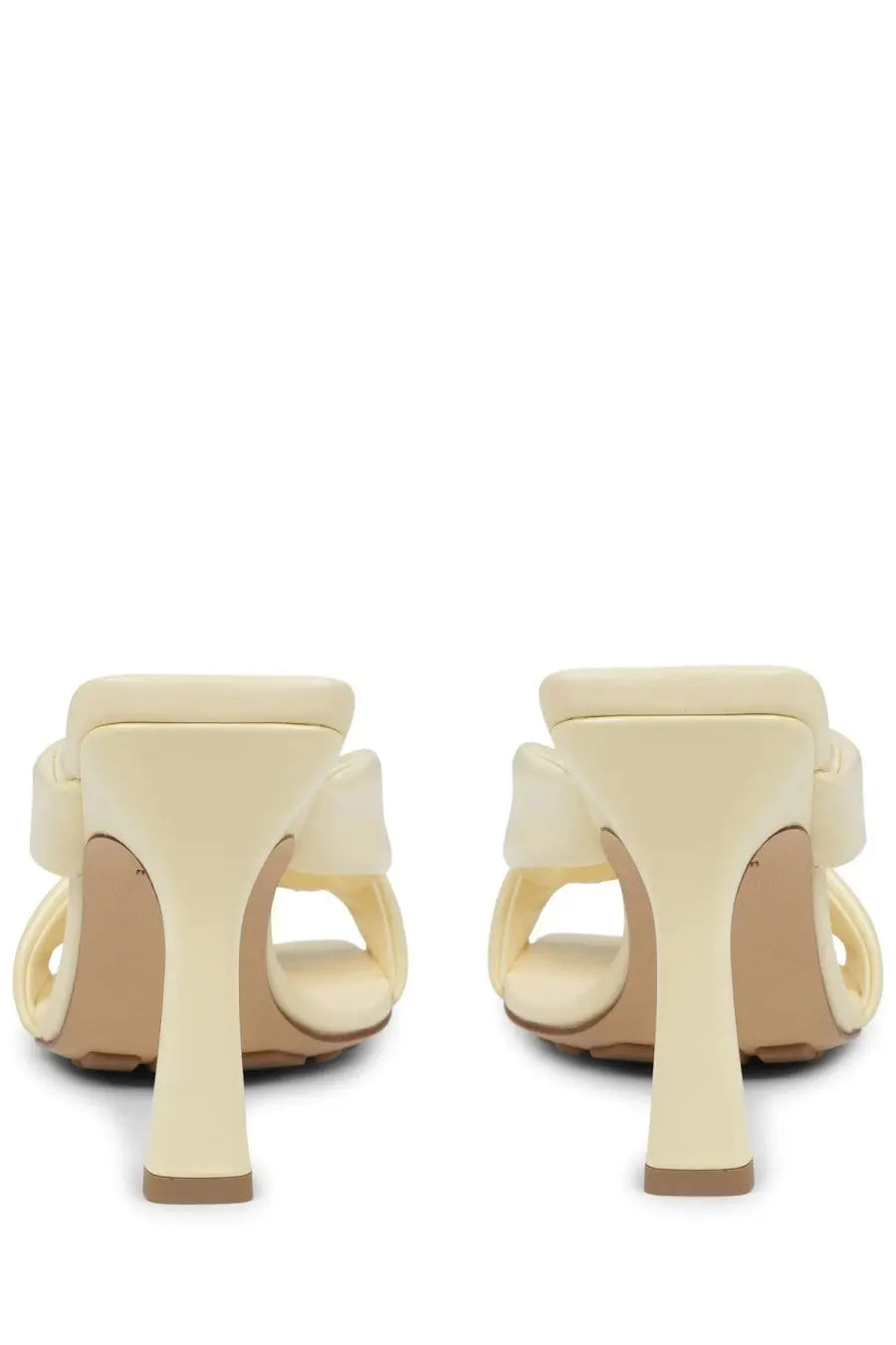 Creamy beige leather mules by bottega veneta with a glossy finish and elegant knot detail at the back side