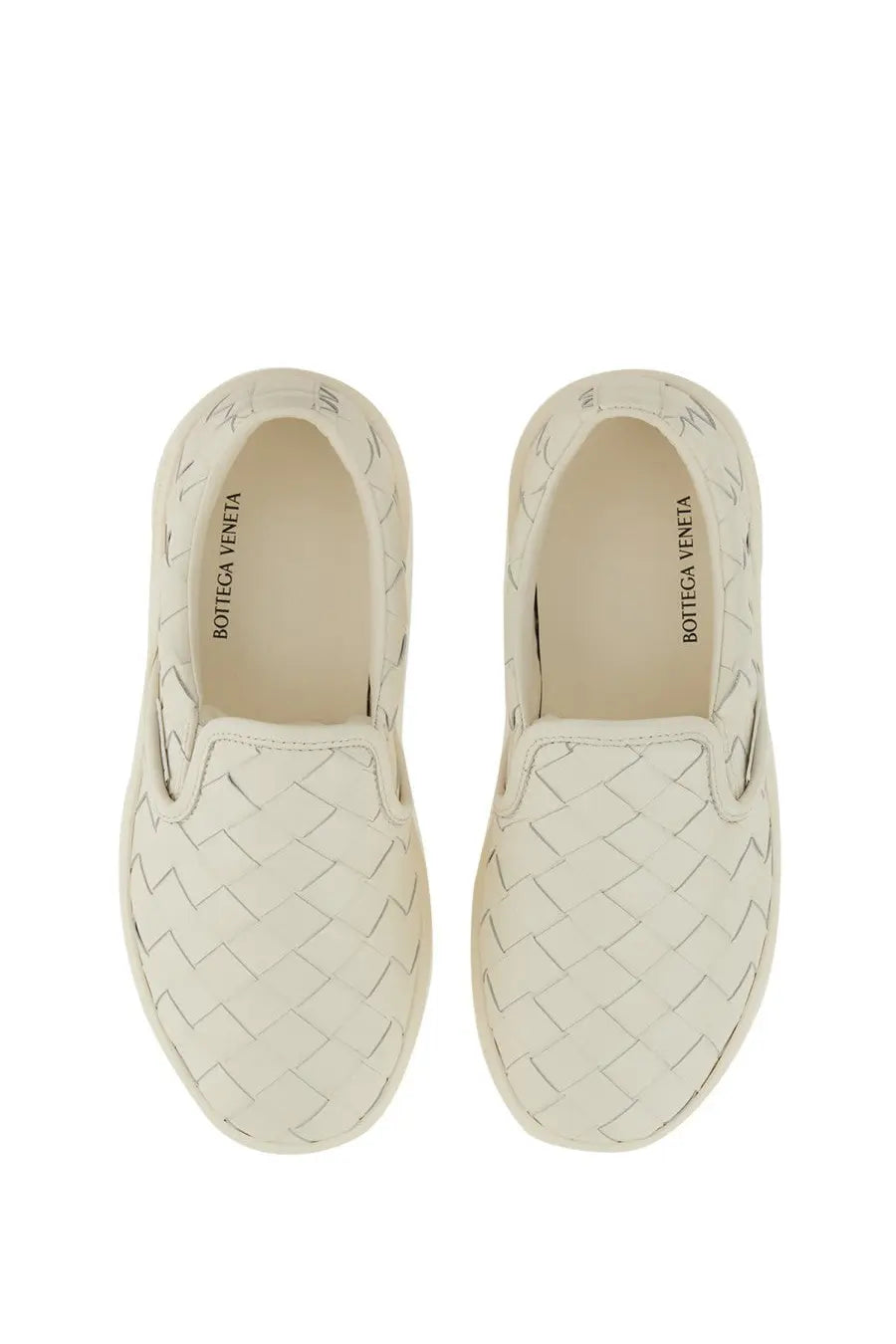 Cream-colored Bottega Veneta women’s Sawyer loafers with signature intrecciato woven leather pattern