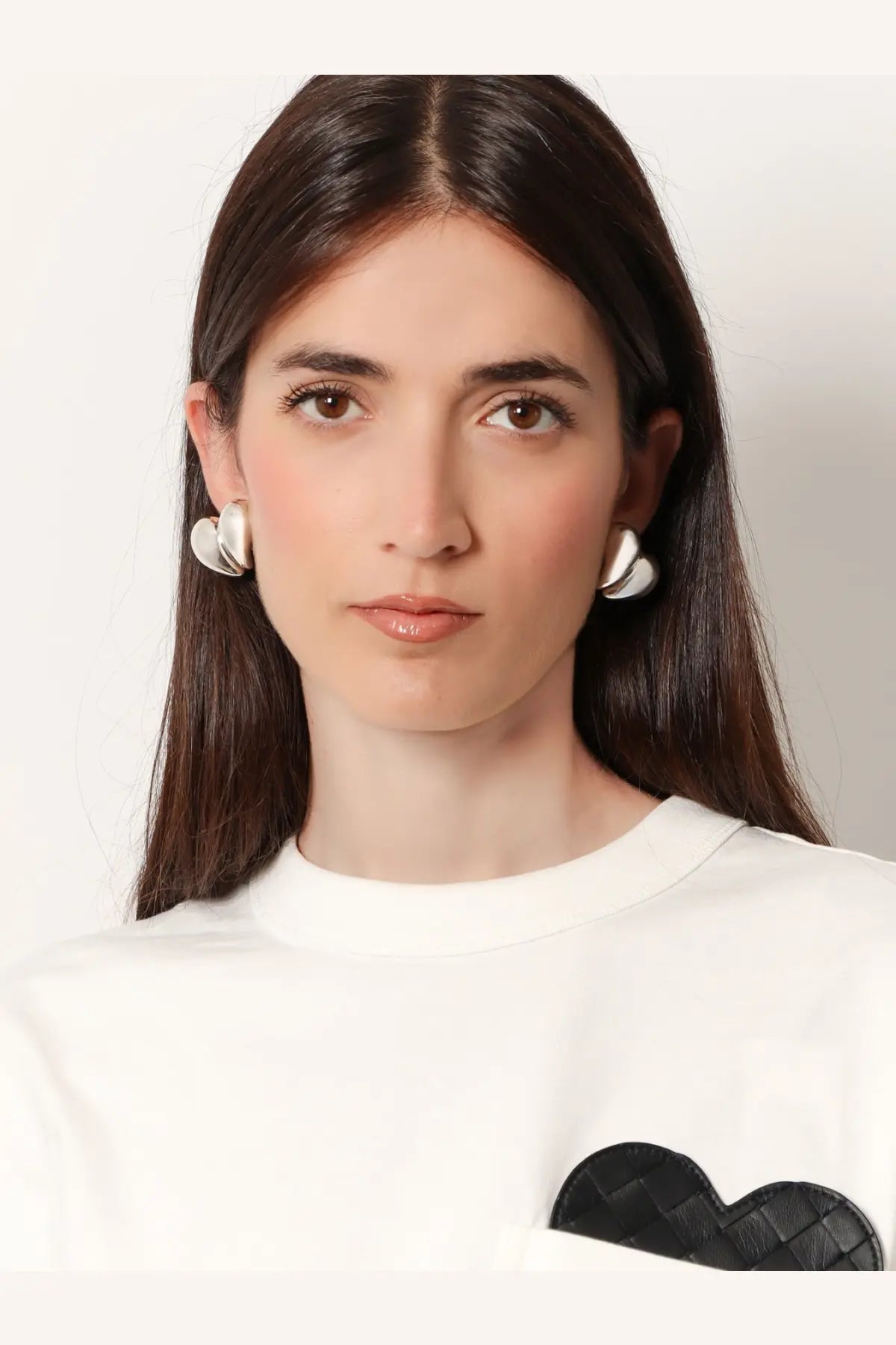 Bottega Veneta women’s silver earrings round white with polished silver finish and subtle concave design