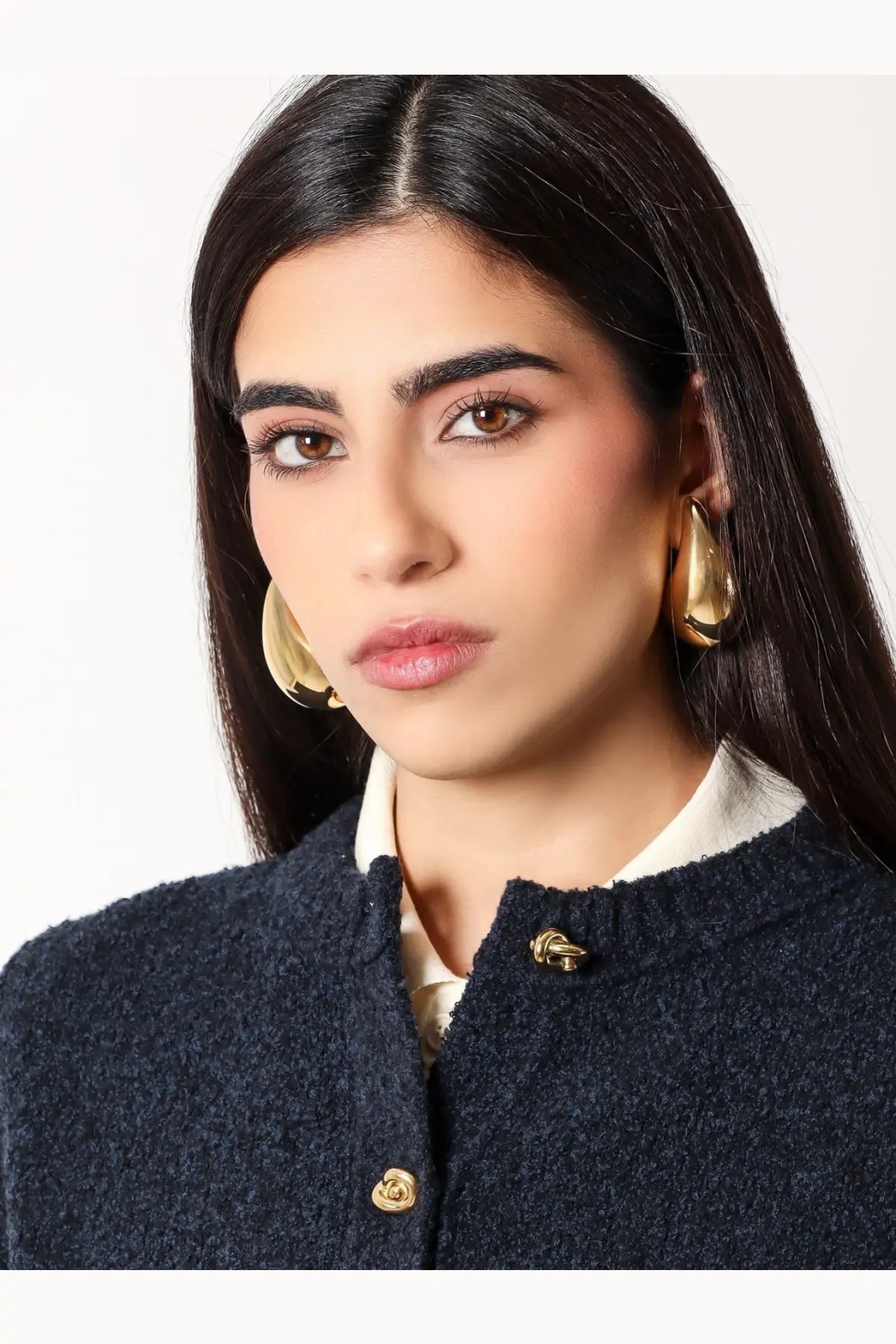Bottega Veneta women’s yellow gold hoop earrings with polished reflective sterling silver finish