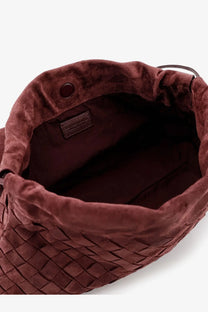 Bottega Veneta women’s suede giorno crossbody bag deepmahogany with a rich burgundy velvet drawstring pouch and leather tag
