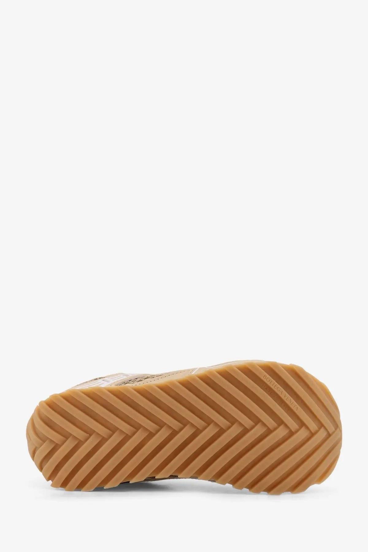 Tan rubber sole with herringbone tread pattern on bottega veneta women’s beige suede and rubber sneakers
