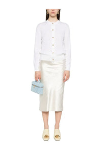 Light blue satin mini handbag with gold-tone hardware paired with Bottega Veneta women’s white wool cardigan