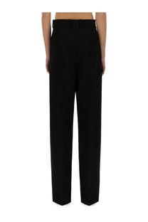 Bottega Veneta women’s black wool high-waisted straight-leg trousers with tailored fit and subtle back pleats showing back view