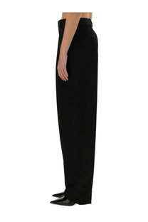Black high-waisted wide-leg wool pants with a sleek tailored fit by bottega veneta for women