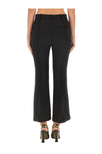 Black tailored wool trousers by bottega veneta with a straight-leg cut and subtle back pleats shown from the back side