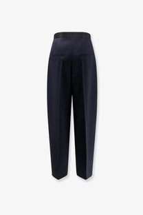 Bottega Veneta women’s black wool trousers with navy blue high-waisted sleek tailored fit and subtle front pleats
