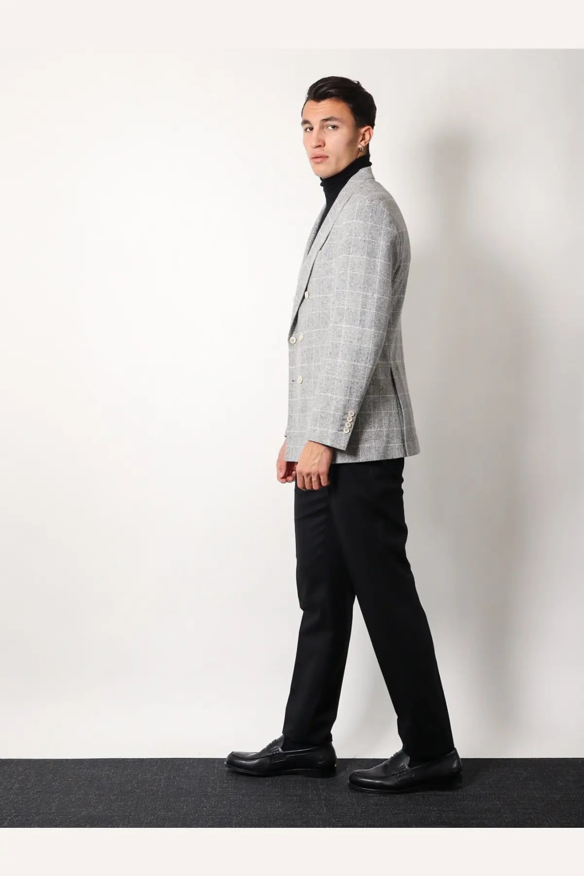 A gray checkered wool double-breasted blazer with notched lapels paired with brunello cucinelli mens cashmere and silk turtleneck black