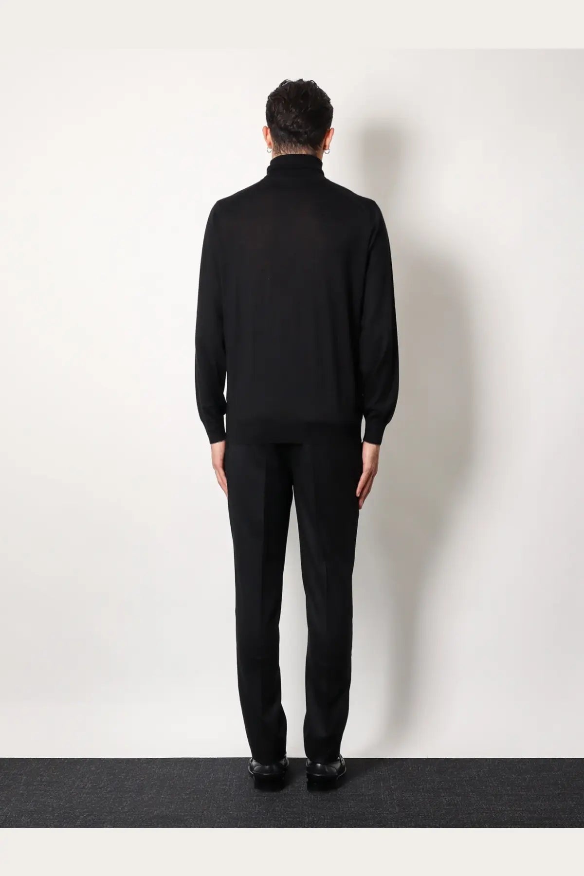 Brunello Cucinelli men’s black cashmere and silk turtleneck sweater with smooth fitted silhouette and ribbed cuffs