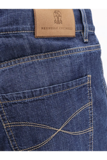 Dark blue cotton denim jeans with tan leather brunello cucinelli logo patch on the back side