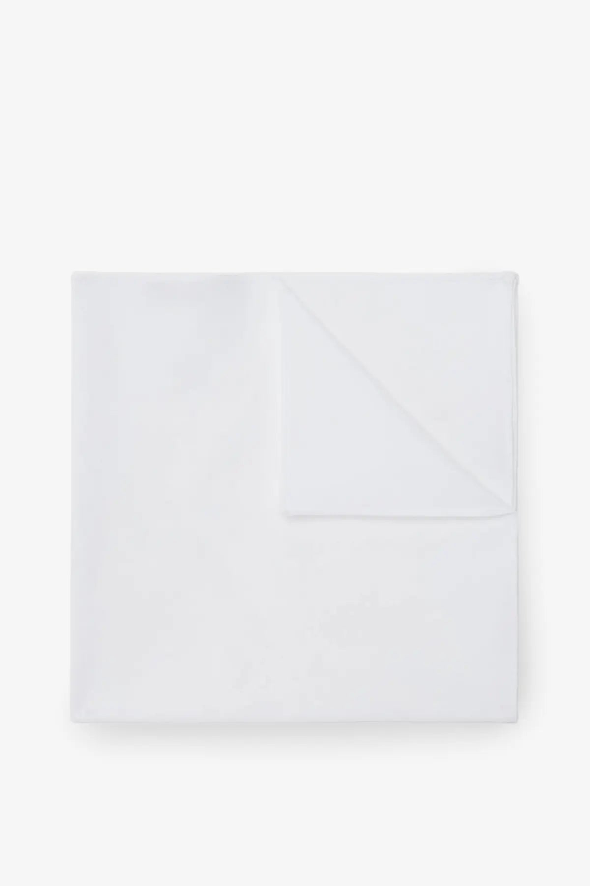 A crisp white cotton handkerchief by Brunello Cucinelli neatly folded with subtle texture and clean edges