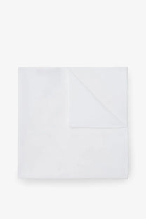 A crisp white cotton handkerchief by Brunello Cucinelli neatly folded with subtle texture and clean edges