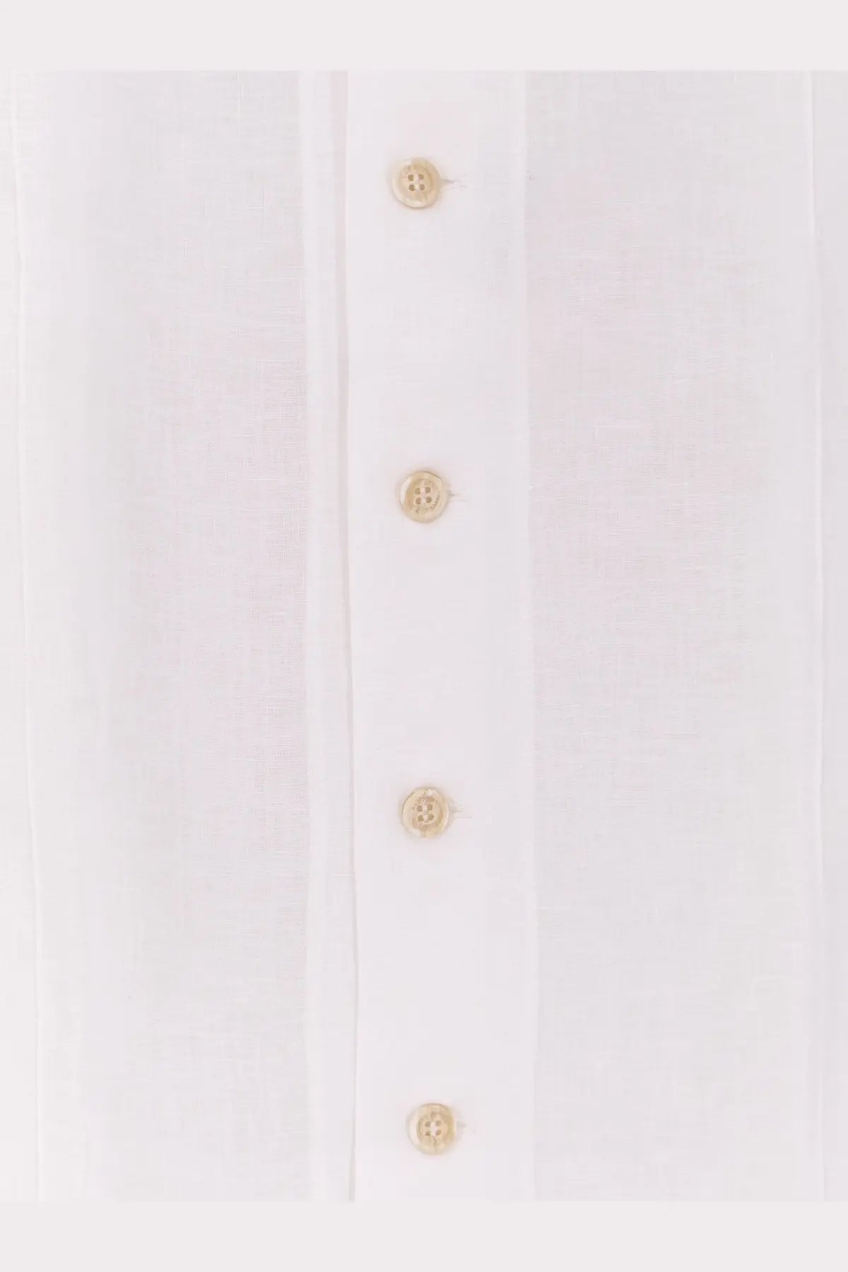 A row of four small beige buttons on the front placket of a brunello cucinelli men’s easy fit white linen shirt