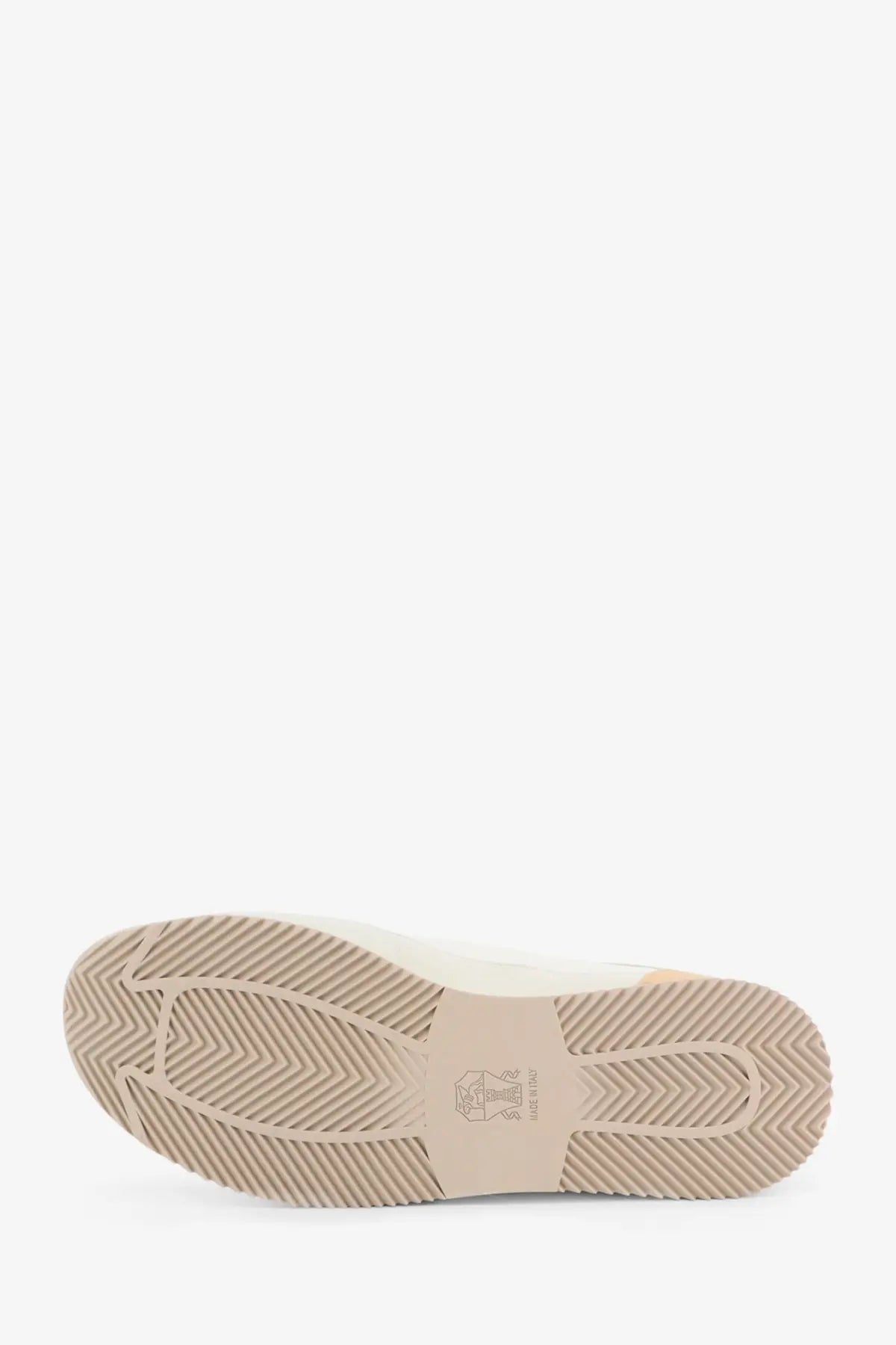 Beige rubber sole with textured herringbone pattern and brunello cucinelli logo on white men’s leather sneakers