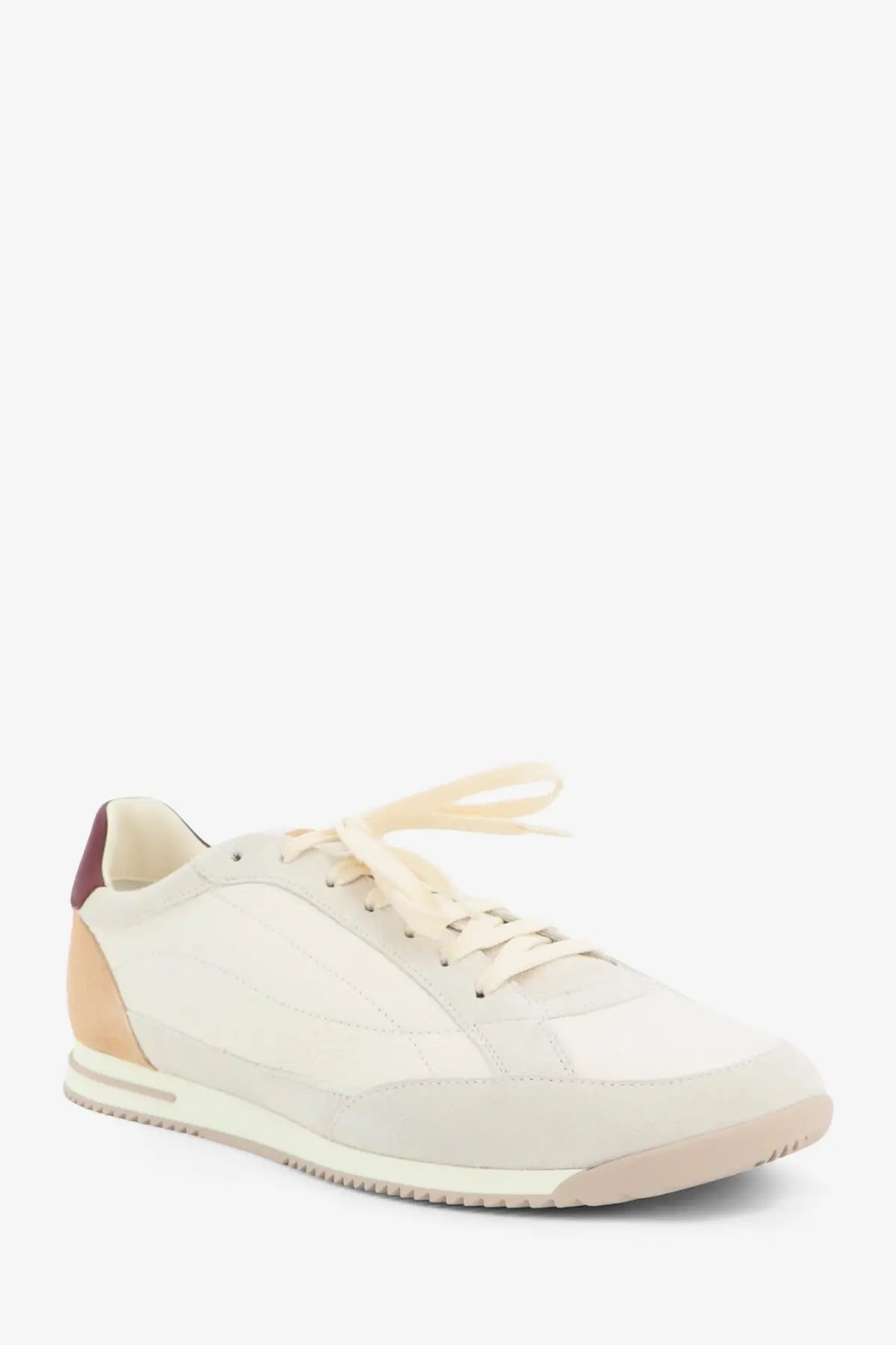 Brunello Cucinelli men’s leather sneakers in cream suede with maroon heel tab and beige accents on toe cap midsole and laces