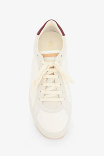 Brunello Cucinelli men’s white leather sneaker with burgundy heel tab and cream laces front view