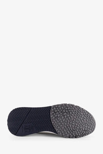 The shoe sole of brunello cucinelli men’s low top cotton knit and leather sneakers features navy rubber with grey heel tread