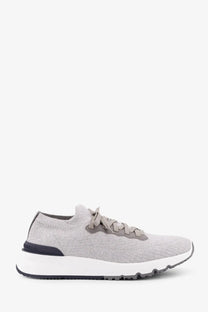 Back view of brunello cucinelli men’s low top gray knit sneaker with white midsole black outsole and subtle heel branding