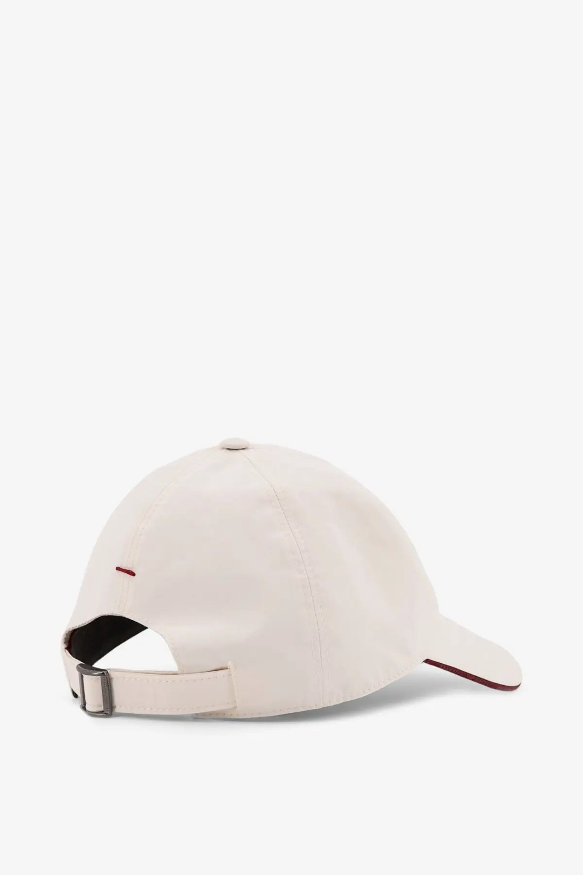 Cream-colored brunello cucinelli men’s nylon baseball cap showing back with red stitch and matching red trim on brim