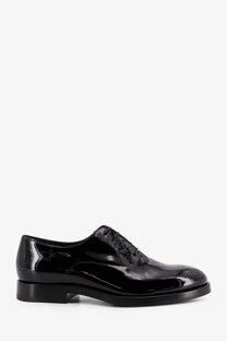 Brunello Cucinelli men’s black patent leather oxford shoe with glossy finish and classic lace-up design