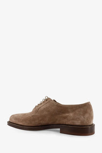 Brunello Cucinelli men’s derby shoe in tan suede with dark brown leather sole and matching laces