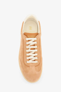 Brunello Cucinelli men’s beige low-top sneaker in tan suede with white laces and light beige rubber sole