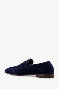 Brunello Cucinelli men’s suede loafers in navy blue with dark brown leather sole and heel shown from the back side