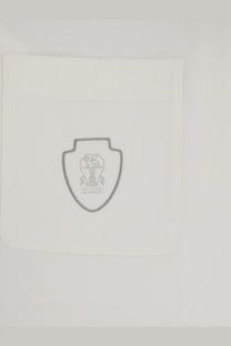 Brunello cucinelli men’s white virgin wool polo shirt with a white paper napkin featuring a gray shield logo