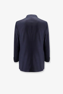 Navy blue tailored blazer with structured silhouette and subtle seam detailing made of virgin wool and silk by brunello cucinelli