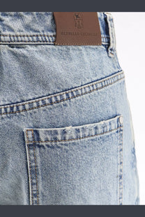 Light-wash denim brunello cucinelli women’s the baggy jean tapered leg with brown leather brand tag on the back