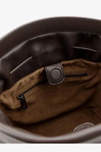 Brown suede-lined interior of brunello cucinelli womens bucket mellow leather shoulder bag with black zipper and metal tab