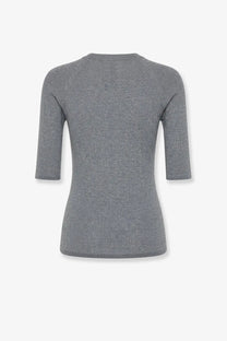 A sleek heather gray brunello cucinelli women’s cashmere and viscose blend lurex sweater with three-quarter sleeves and rounded neckline