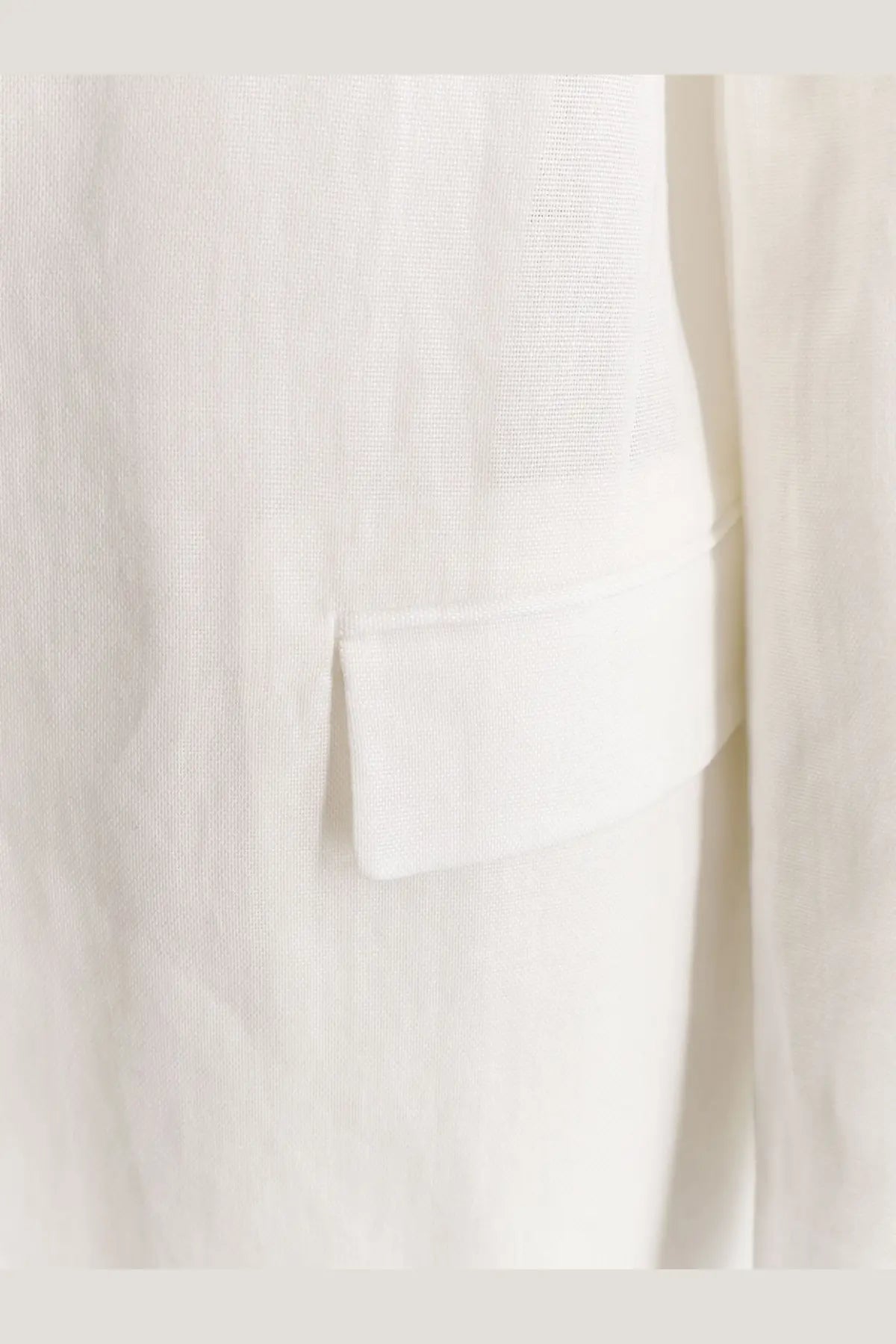 Brunello Cucinelli women’s white cotton blazer pocket with crisp linen texture and tailored stitching detail