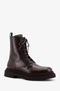 Brunello Cucinelli women’s dark brown leather combat ankle boot with laces and chunky sole in gold accents