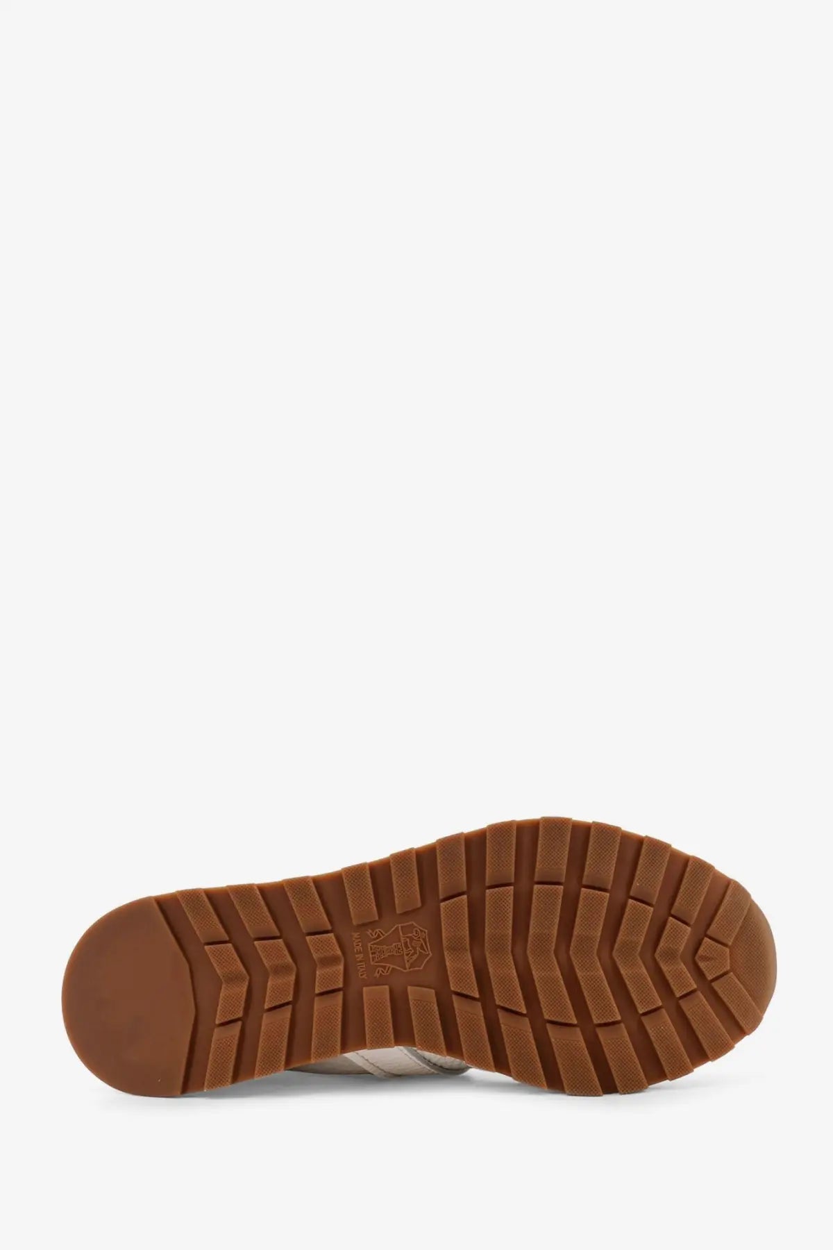 Brown rubber sole with textured blocky tread on brunello cucinelli women’s white leather sneakers